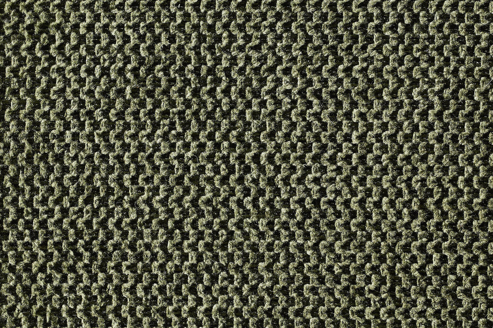 Robustes ORTHO Hundebett mit gewebter Struktur in verschiedenen Grüntönen für komfortable Entspannung.