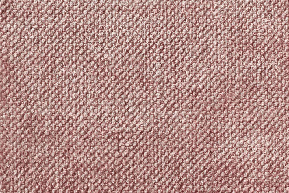 ALT-Text: Sanftes rosa CLASSIC Hundebett GLAM mit genoppter Textur für angenehme Haptik und Komfort für Ihren Hund.