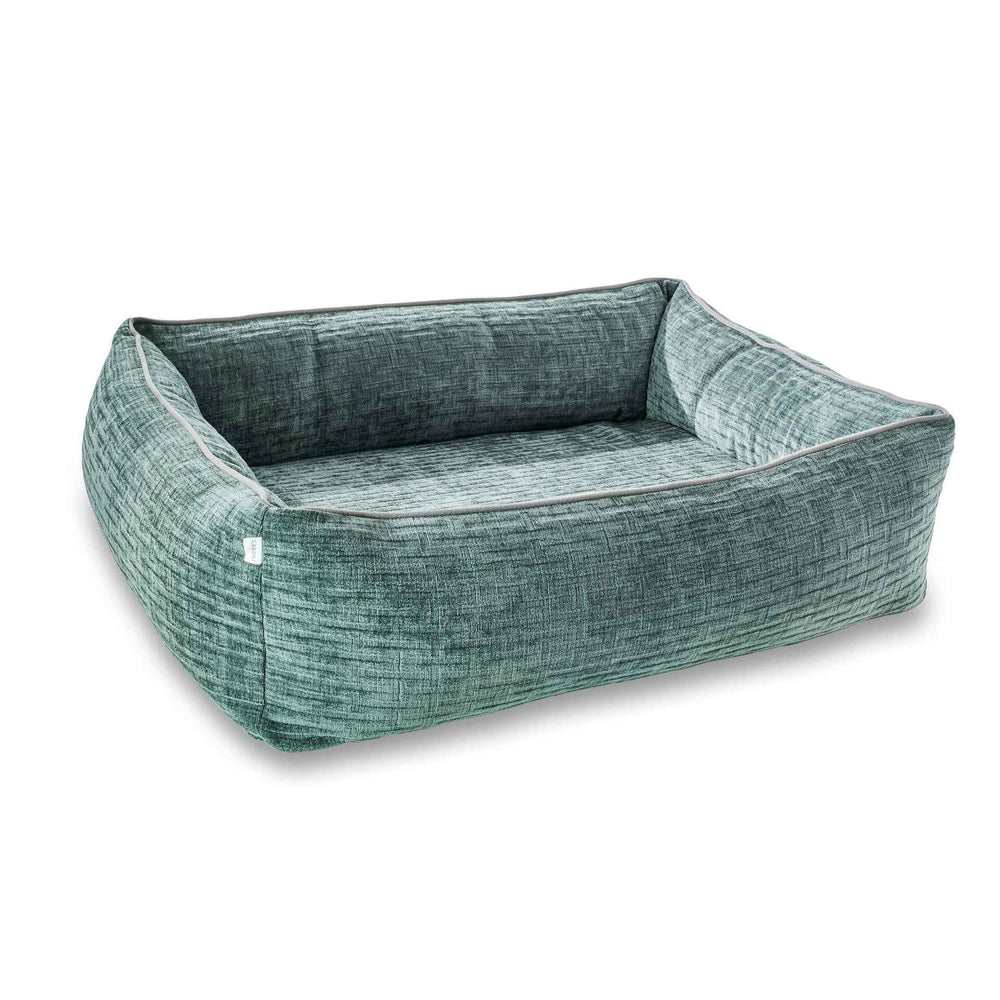 "Komfortables ORTHO Hundebett NOVA in rechteckiger Form mit weichem, grünem Stoff und hohem Rand für Hunde."