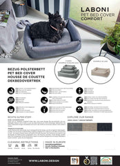 Schwarzer Hund im modernen CLASSIC Hundebett von LABONI in stilvoller Wohnumgebung mit Pflanzen.