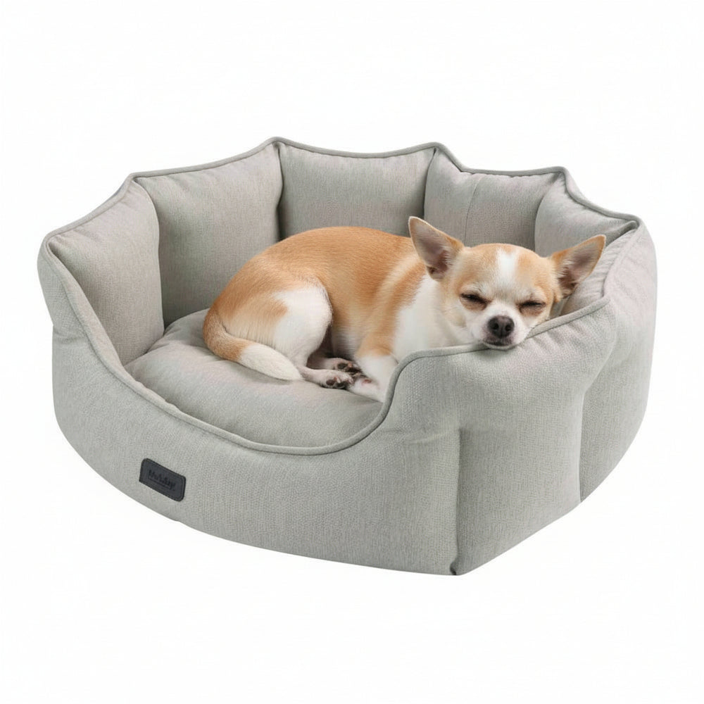 Hundefreundliches ovales Bett "VALEA" in hellem Grau, weich gepolstert und blütenförmig gestaltet, ideal für kleine Hunde.
