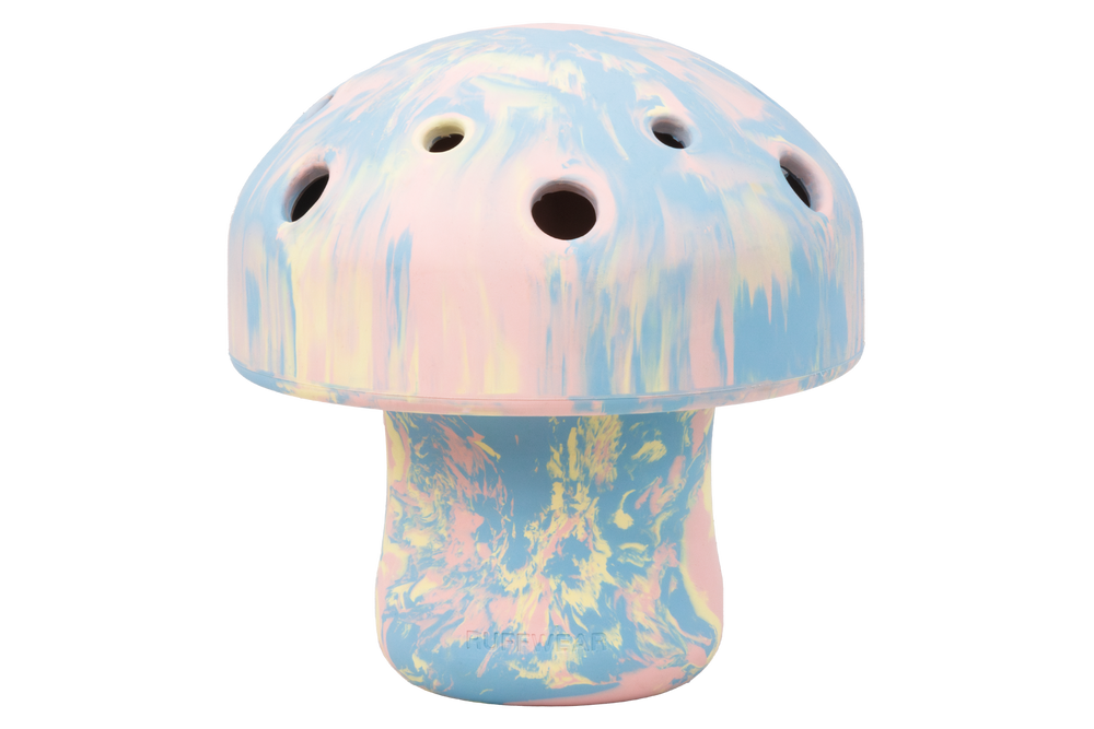 „Pastellfarbenes Porcini™ Hundespielzeug in Form eines stilisierten Pilzes mit Löchern und kuppelartigem Kopf.“