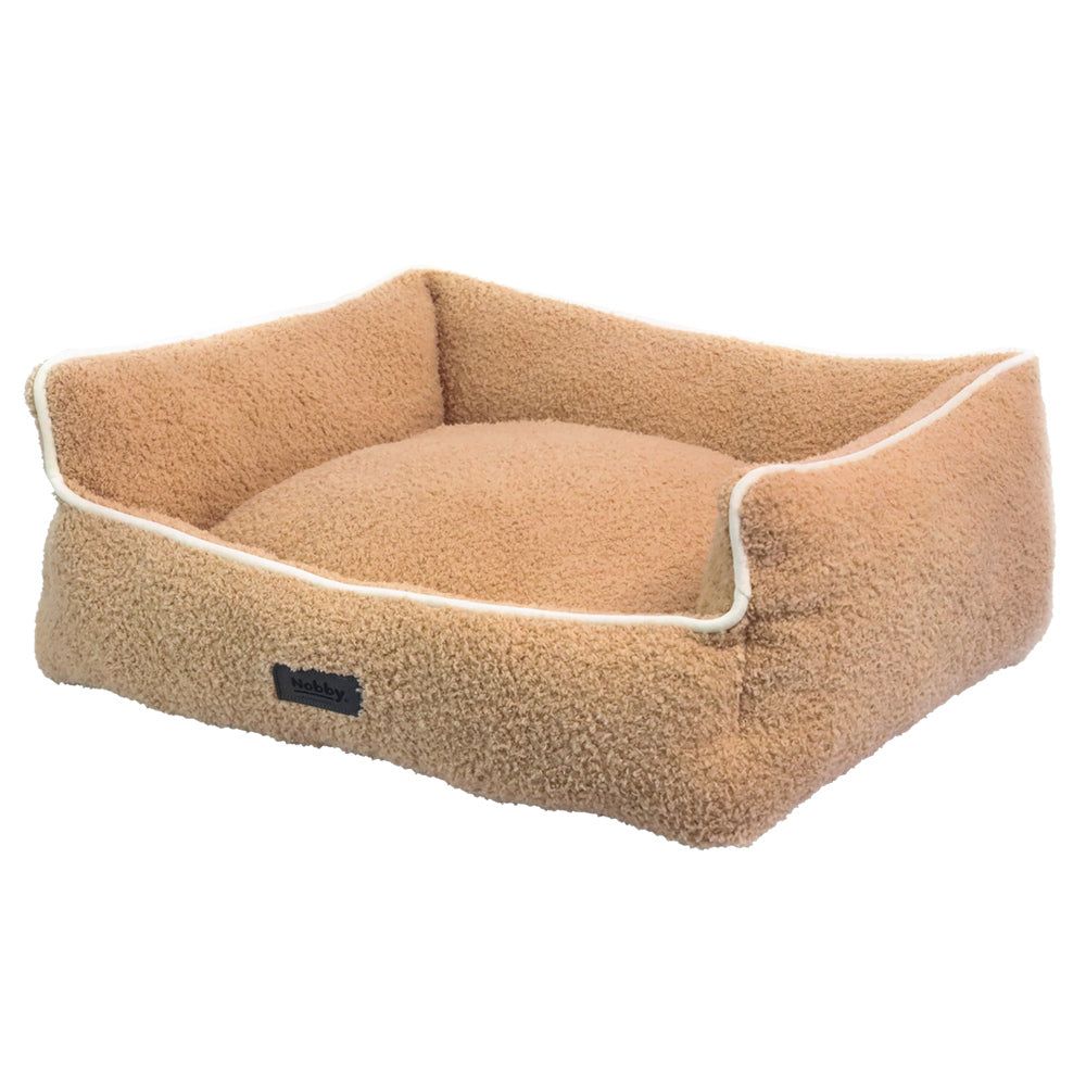 Komfortbett Cloudy: Hundefreundliches, rechteckiges Bett mit beiger, weicher Oberfläche und dekorativer Naht.