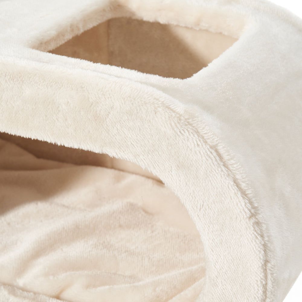 Gemütliche, beige Katzenschlafbox mit zwei Öffnungen, flauschiger Oberfläche und isothermisch gepolsterter Innenseite für Katzen.