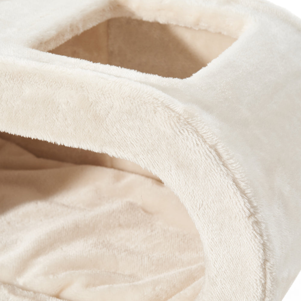 Gemütliche, beige Katzenschlafbox mit zwei Öffnungen, flauschiger Oberfläche und isothermisch gepolsterter Innenseite für Katzen.