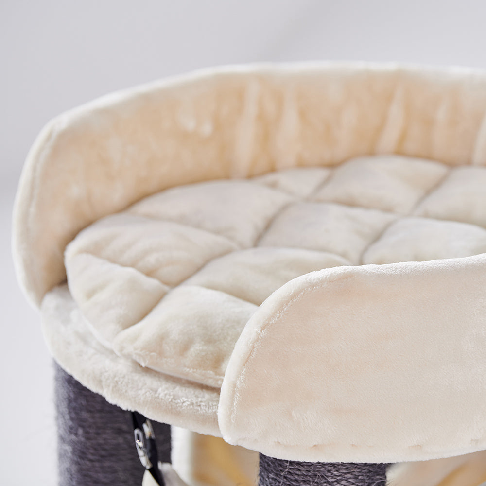 Rundes, gepolstertes Katzenbett in Beige mit gestepptem Design und erhöhtem Rand für zusätzlichen Komfort.