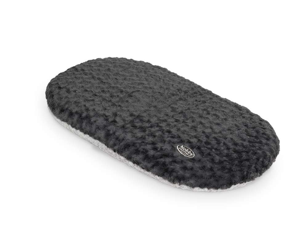 Ovales Kissen "SEOLI" aus weichem Plüsch mit strukturierter Oberfläche und Logo am Rand. Ideal für Komfort und stilvolle Akzente.