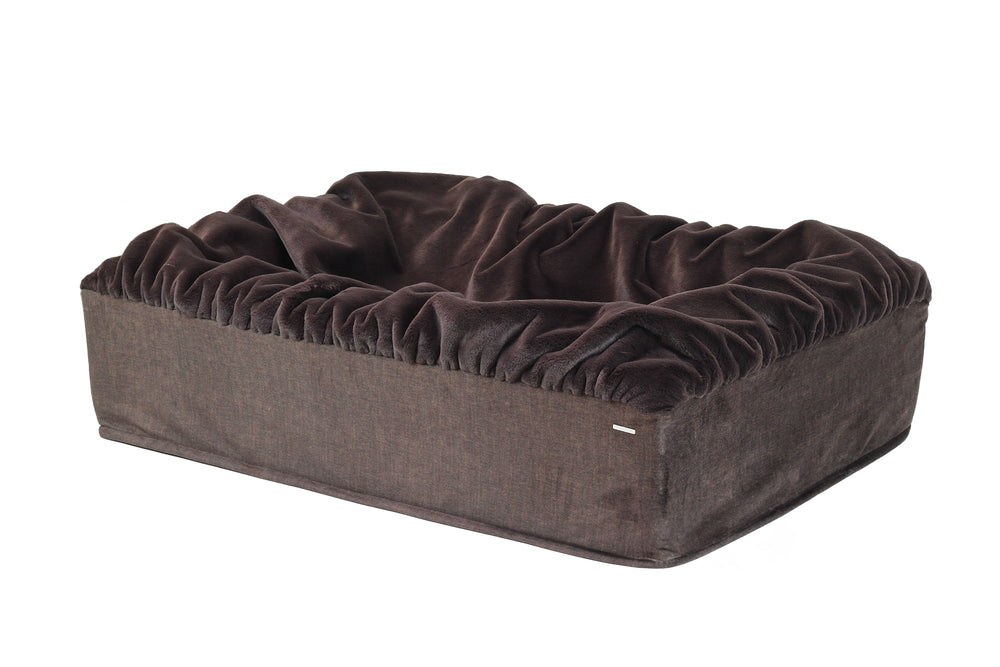 Behold das stylische Hundebett Buddelbox® in braun mit rüschiger Umrandung für ultimativen Komfort.