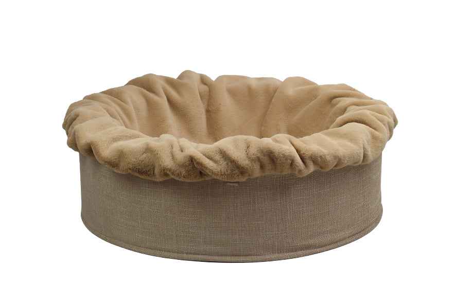 Rundes, beiges Hundebett Buddelnest® mit weichem Stoffbezug und knuddeligem Rand für optimalen Komfort.