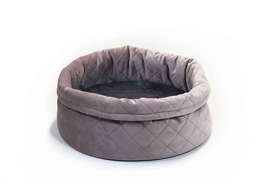 Rundes Hundebett Catty Caro in neutralem Grauton mit gepolsterter Liegefläche und hohen Rändern für optimalen Komfort.