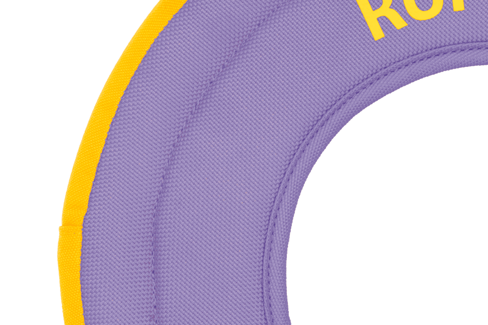 Runder, lila Hydro Plane™ Frisbee mit gelben Akzenten und dem Schriftzug "KOR" für Wasserspiele und Freizeitaktivitäten.