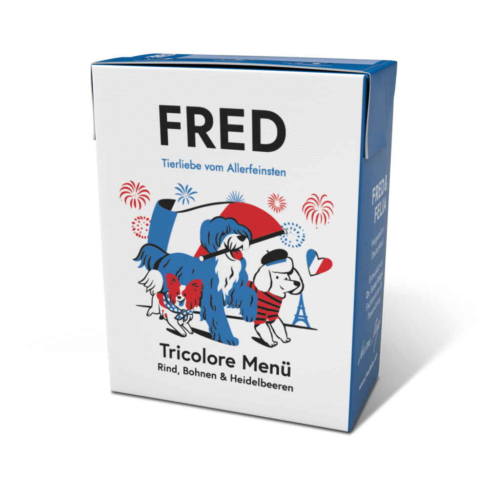 Verpackung des FRED Tricolore Menüs mit Hundeillustrationen und französischen Symbolen wie dem Eiffelturm.