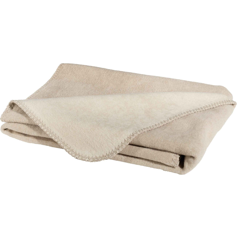 Helle, stilvolle Wendedecke REVERSO in hellbeige, weich und hochwertig genäht, perfekt für gemütliche Wohnakzente.