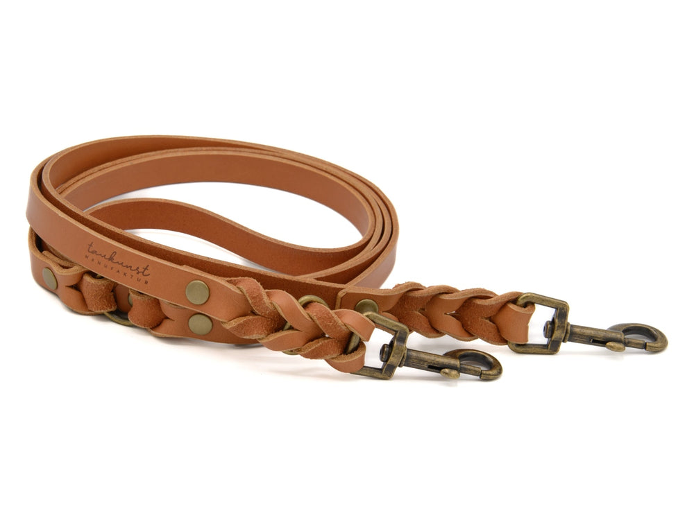 Braune geflochtene Lederleine mit zwei Metallhaken und stabilen Druckknöpfen für Hunde.