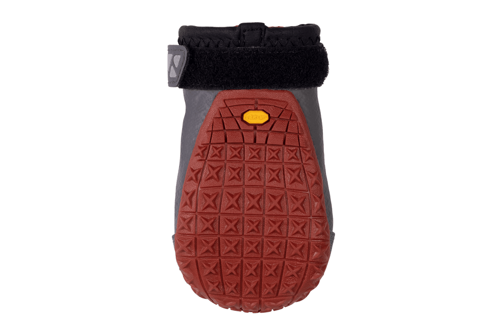 Grip Trex™ Hundeschuhe mit roter Sohle und grauem Obermaterial, ausgestattet mit einem schwarzen Klettverschluss.