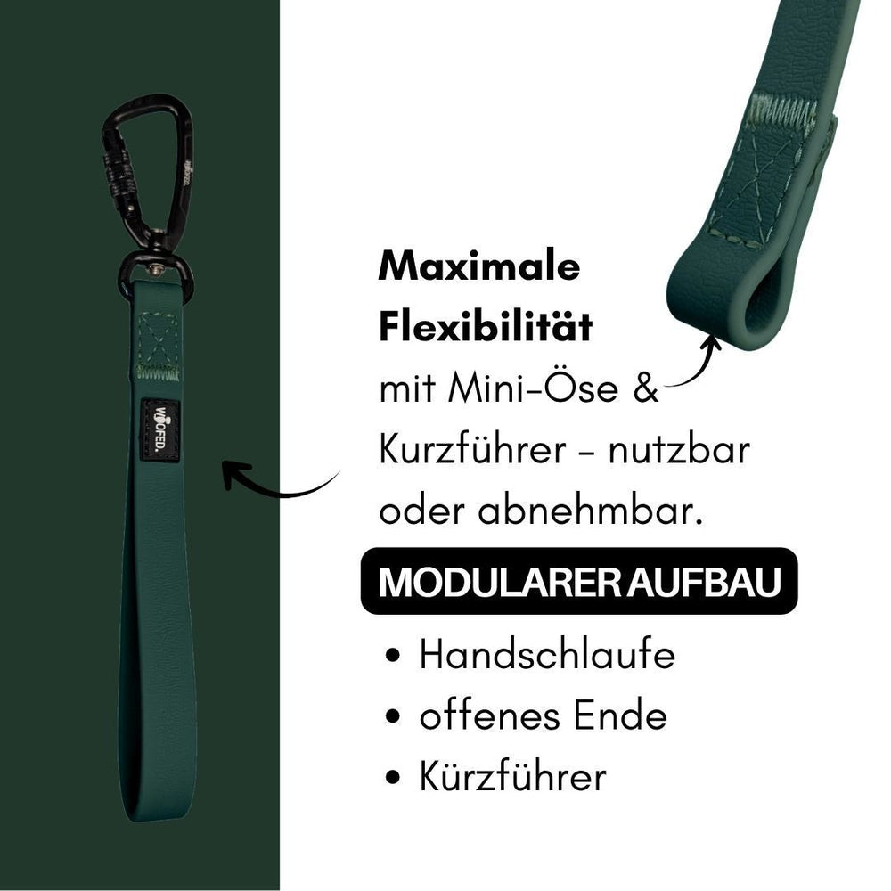 Grüne WOOFLEX® Schleppleine mit Sicherheitskarabiner, modular und flexibel einsetzbar, inklusive abnehmbarem Kurzführer.