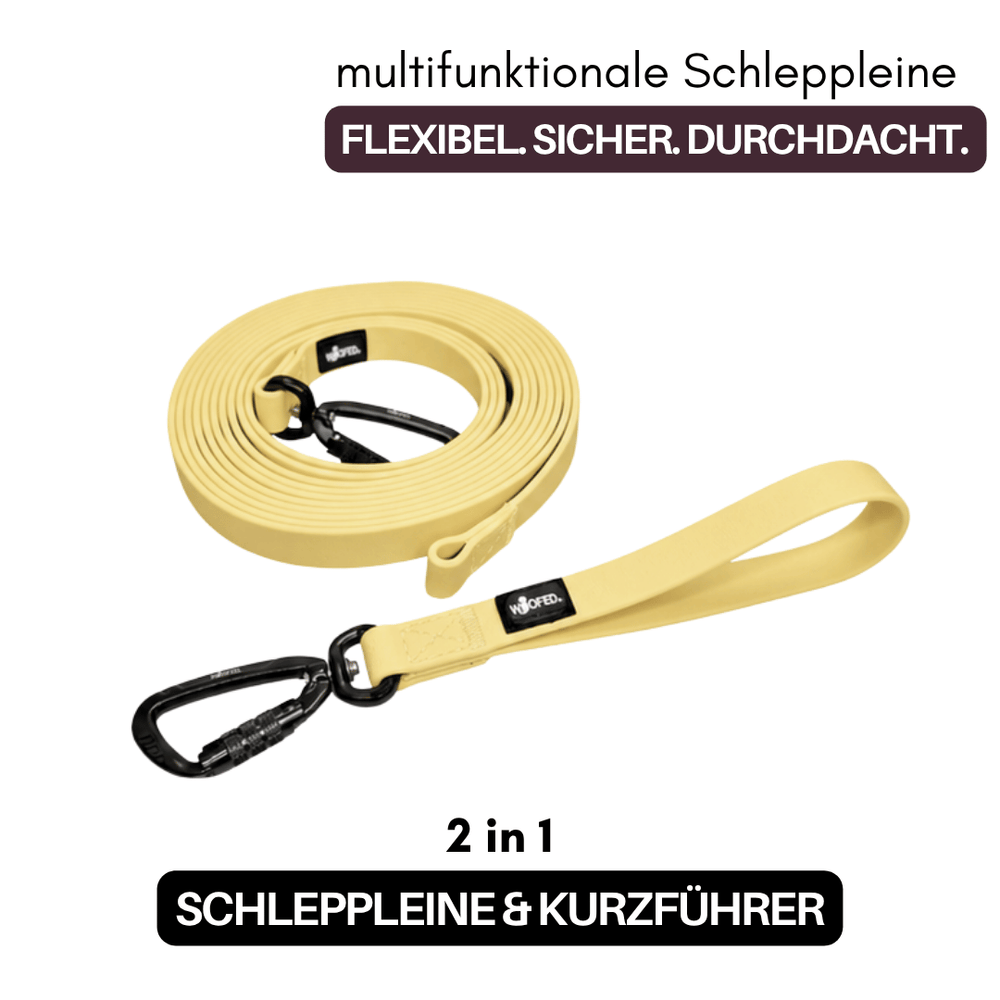 "Multifunktionale WOOFLEX® Schleppleine in leuchtendem Gelb mit Karabinerhaken und gepolstertem Griffstück."