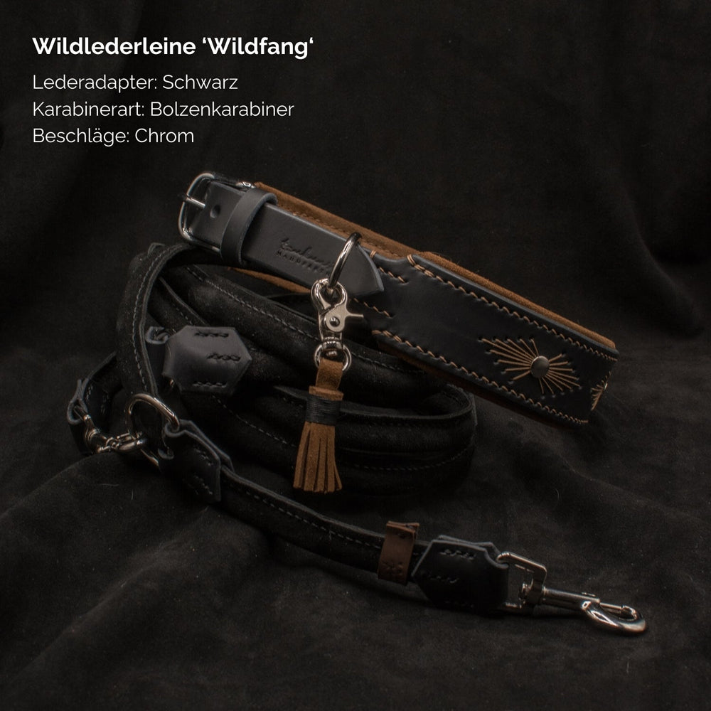Schwarze Wildlederleine "Wildfang" mit Bolzenkarabiner und chromfarbenen Beschlägen, auffälliger Nahtdetail.