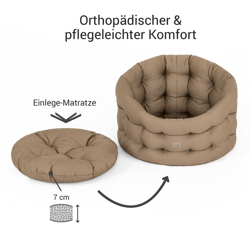 Katzenbett Deluxe in Beige mit rundem, gepolstertem Design für optimalen Komfort und Orthopädie.