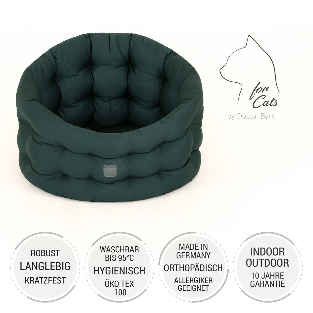 Robustes, dunkelgrünes Katzenbett Deluxe mit runder, gepolsterter Form und hygienischer Waschbarkeit bis 95 °C.
