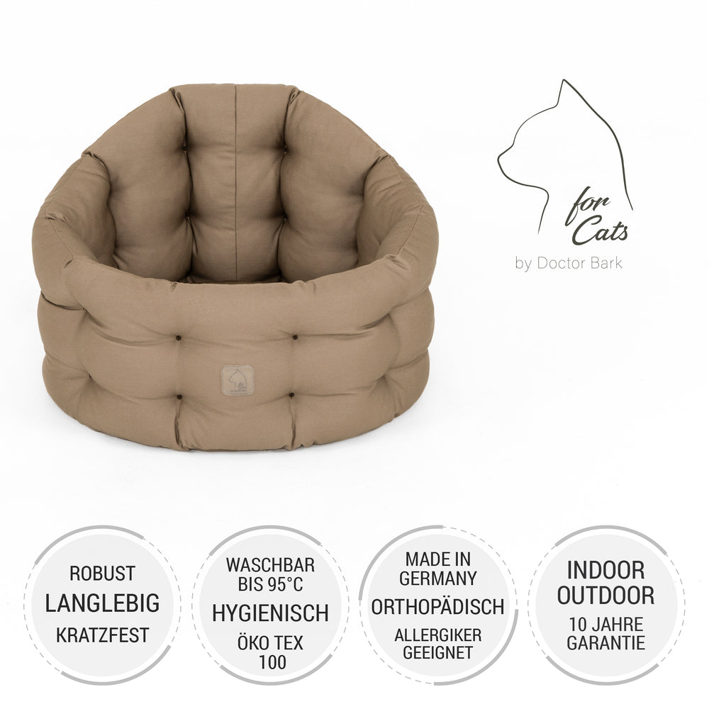 Robustes Katzenbett Deluxe in Beige, rund geformt und waschbar, bietet eine bequeme Liegefläche für Katzen.