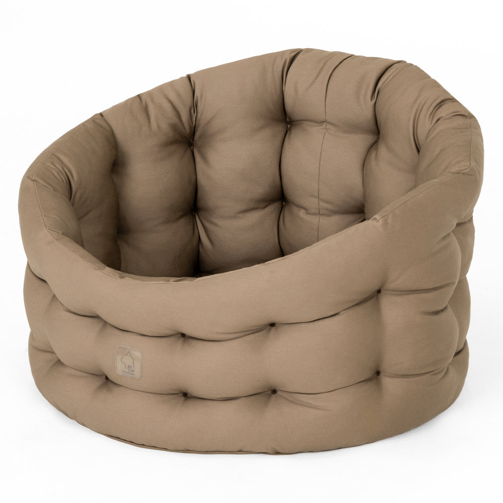 "Beiges, rundes Katzenbett Deluxe mit polsterer Rückenlehne für optimalen Komfort und Ruhe."