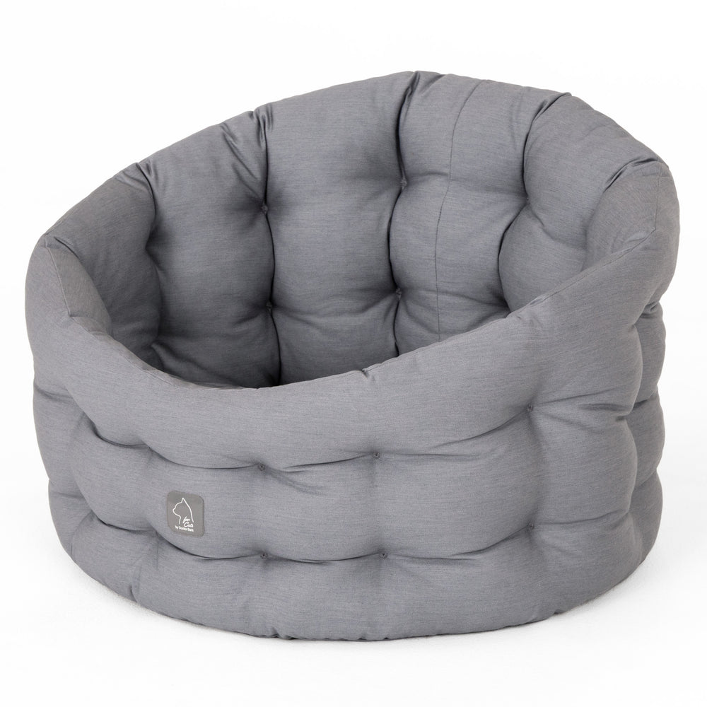 Weiches, graues Katzenbett Deluxe in runder Form mit gepolsterter Oberfläche für optimalen Komfort.