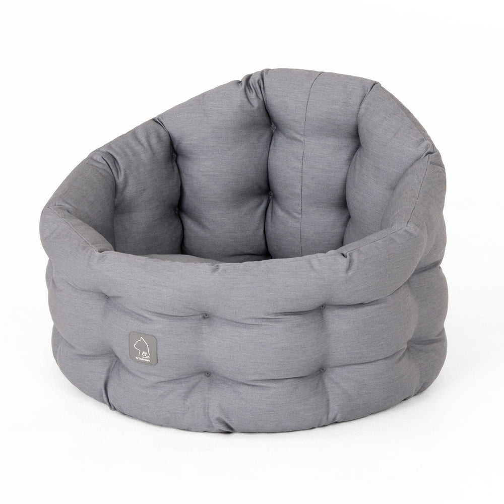 Rundes, graues Katzenbett Deluxe aus weichem Stoff mit gepolsterten Seiten für optimalen Komfort.