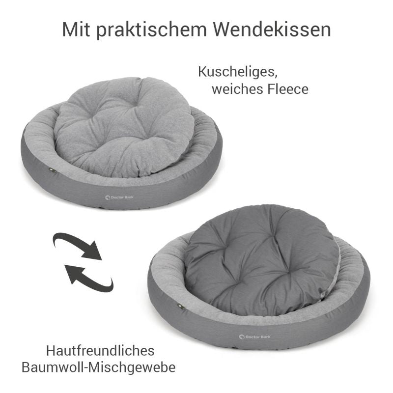 Rundes Hundenest mit wendbarem Kissen aus weichem Fleece in grau, ideal für gemütliche Ruheplätze für Hunde.