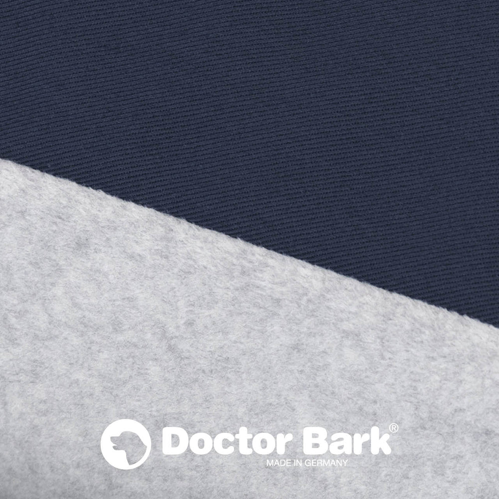 Dunkelblaues strukturiertes Kissenoberteil und graues Fleece mit Doctor Bark-Logo. Ideal für Haustiere und gemütliches Liegen.