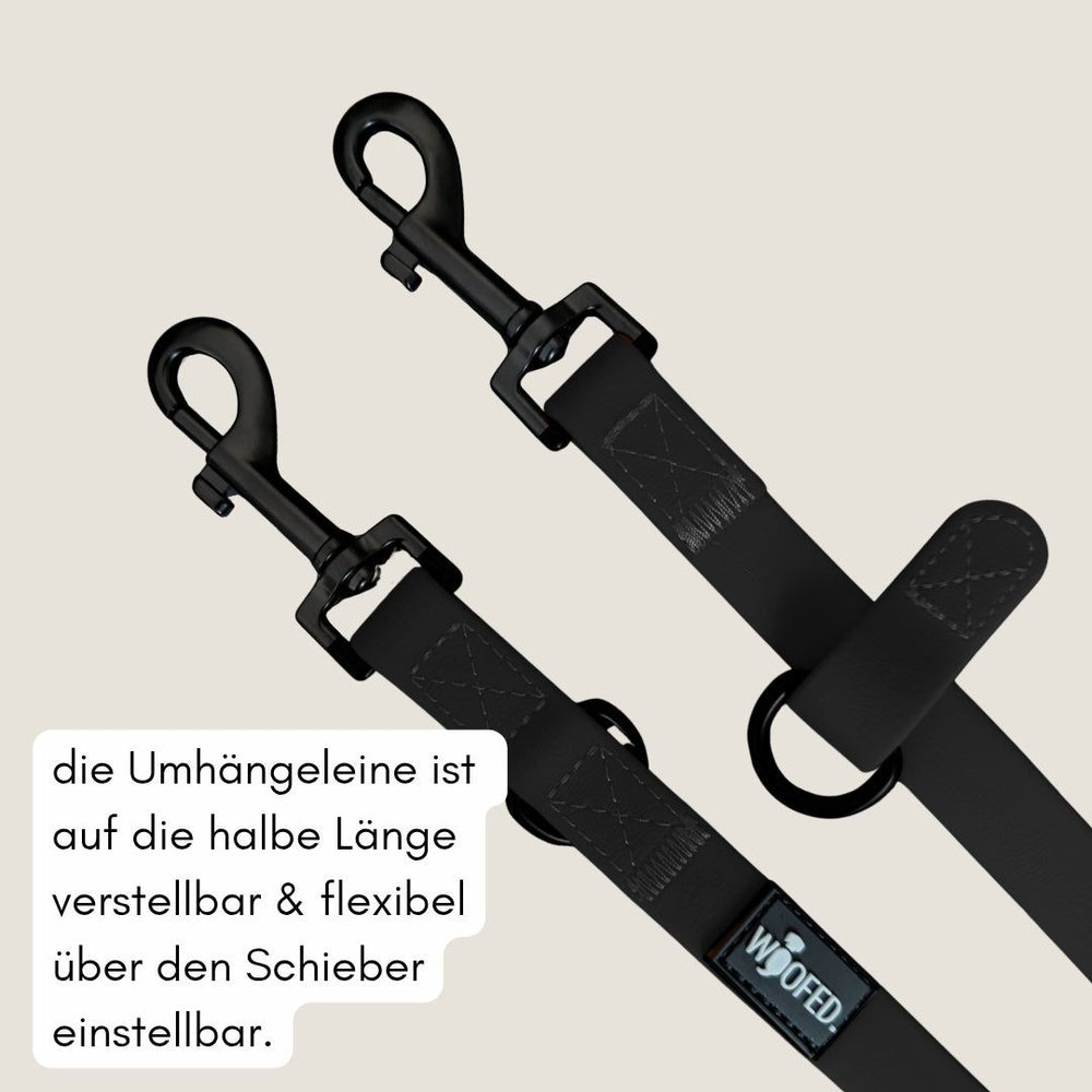 Schwarze umhänbare Leine WOOFLEX® Classic mit zwei Karabinerhaken und verstellbarer Länge für Hunde.