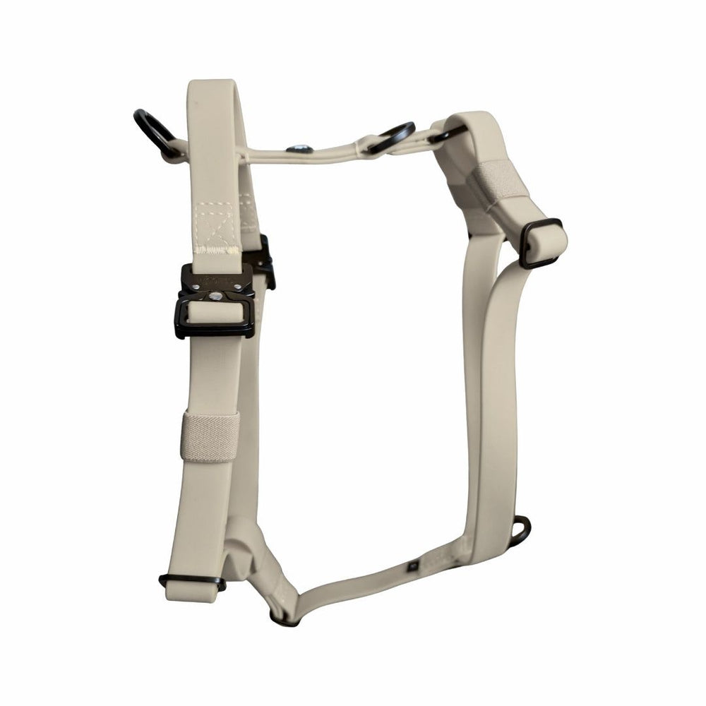 Hellbeiges Y-Hundegeschirr WOOFLEX® mit verstellbaren Riemen und Griff für ideale Tierkontrolle und Komfort.