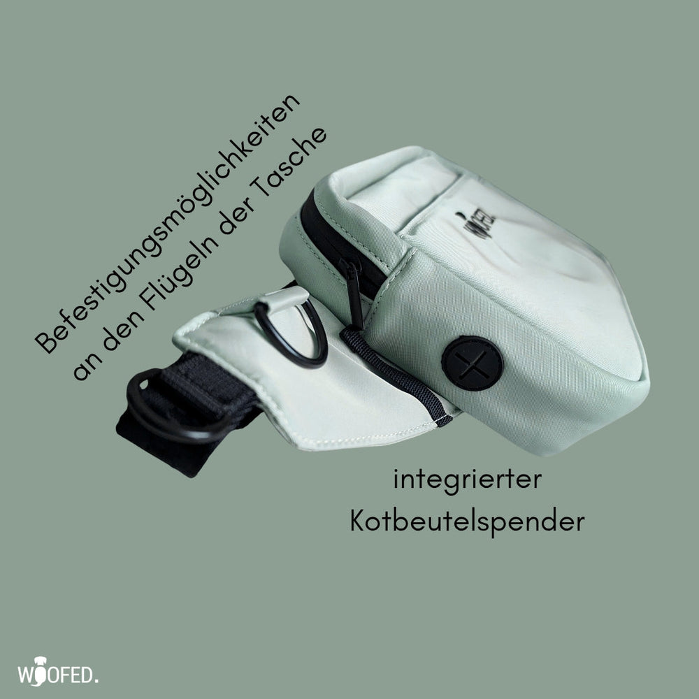 Multifunktionale grüne Gassitasche für Hundebesitzer, als Bauchtasche oder Schultertasche nutzbar, mit Kotbeutelspender.