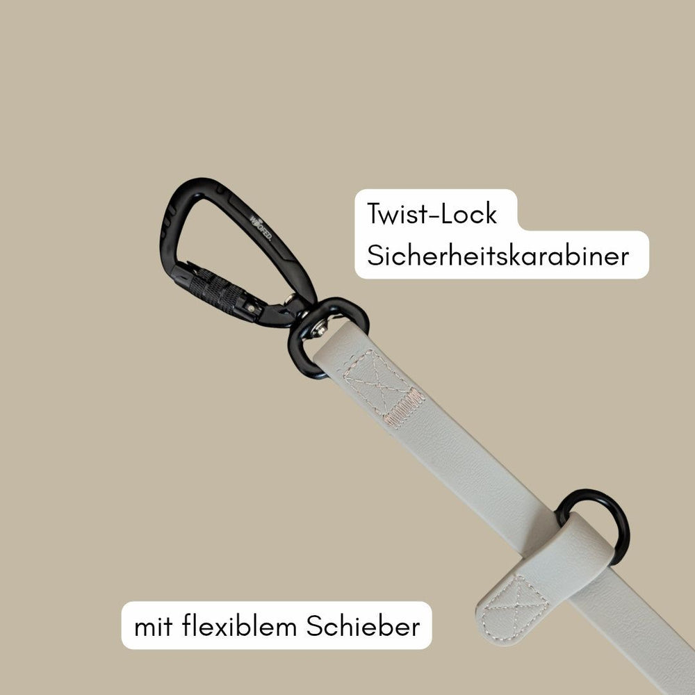 Umhängeleine WOOFLEX® Pro mit schwarz Twist-Lock Karabiner und hellem Gürtel, ideal für Sicherheit und Komfort.