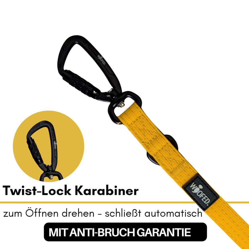 Gelbe Hundeleine aus Nylon mit schwarzem Twist-Lock Karabiner und Anti-Bruch Garantie Aufschrift.