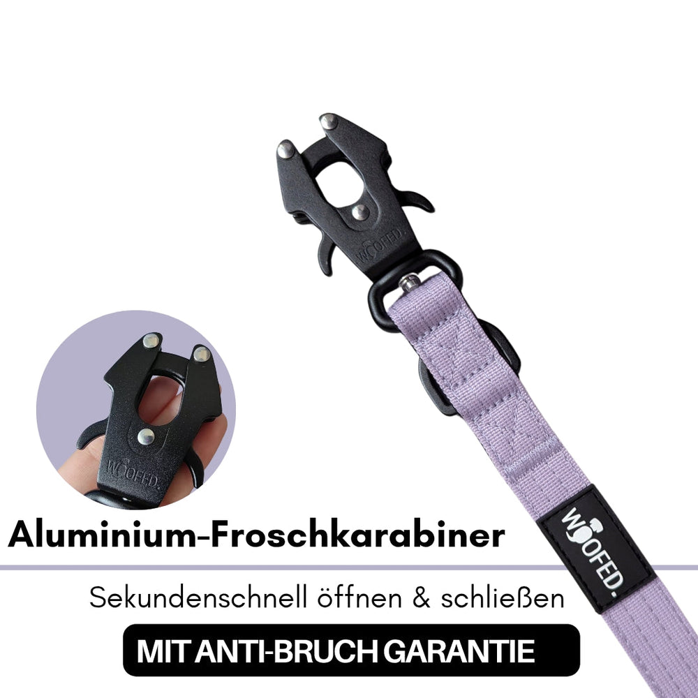 Schwarzer Aluminium-Froschkarabiner mit lila Zubehörband und Anti-Bruch Garantie für zuverlässige Sicherheit.