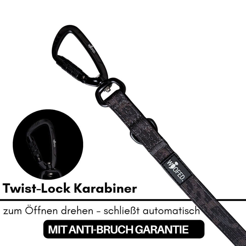 Schwarzer Twist-Lock Karabiner aus Nylon für sichere Hundeleinen, öffnet und schließt automatisch, mit Anti-Bremsfunktion.
