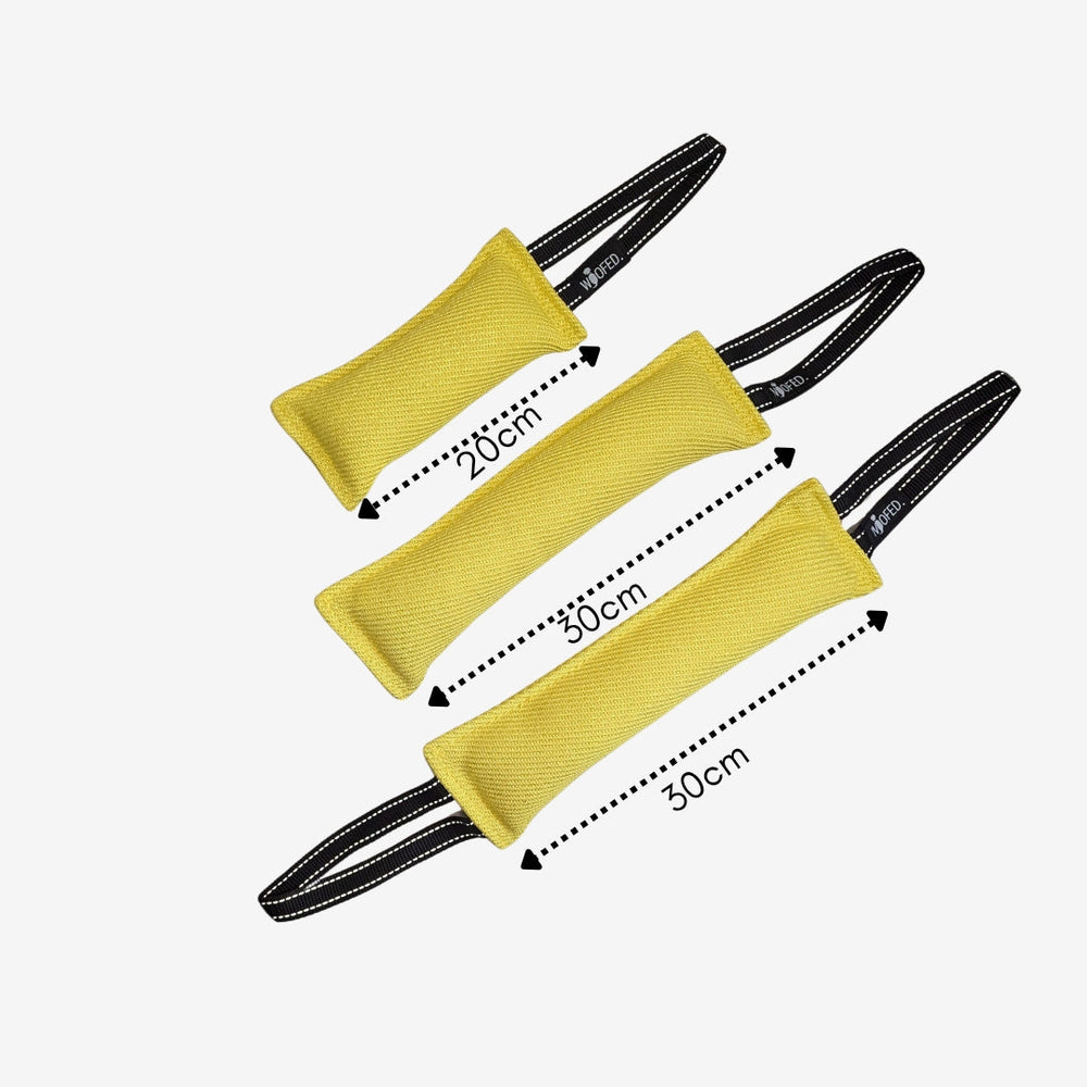 Hundespielzeug Beißwurst in Gelb mit schwarzen Griffen, ideal für Spiel und Training, unterstützt Zahngesundheit und Spielspa