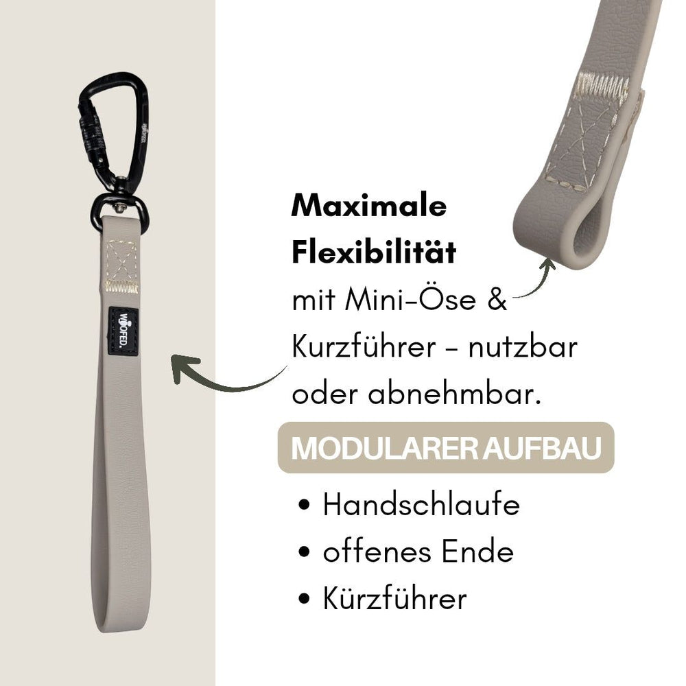 Grauer Hunde-Leinen-Clip WOOFLEX® mit Handschlaufe, offenem Ende und abnehmbarem Kurzführer für maximale Flexibilität.