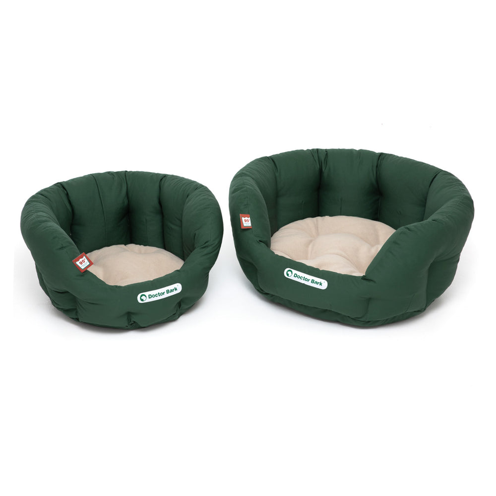 "Orthopädisches Hundenest von Doctor Bark in rundlicher Form, grün mit heller, gepolsterter Liegefläche für Hunde und Katzen."