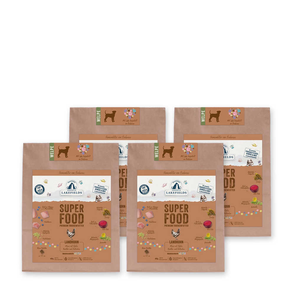 Verpackungen von Lakefields Trockenfutter SUPERFOOD Huhn für Welpen, bunt illustriert und aus braunem Papier.