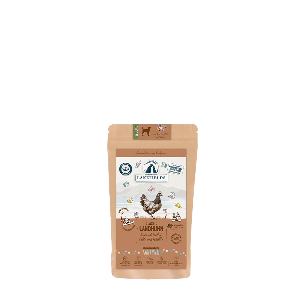 Verpackung von Lakefields Trockenfutter-Menü Huhn für Welpen mit bunten Tiermotiven und Hühnerabbildung.