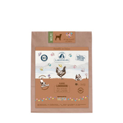 Verpackung des Hundefutters "Lakefields" für Welpen mit Huhn, in braunem Papier und bunten Illustrationen.