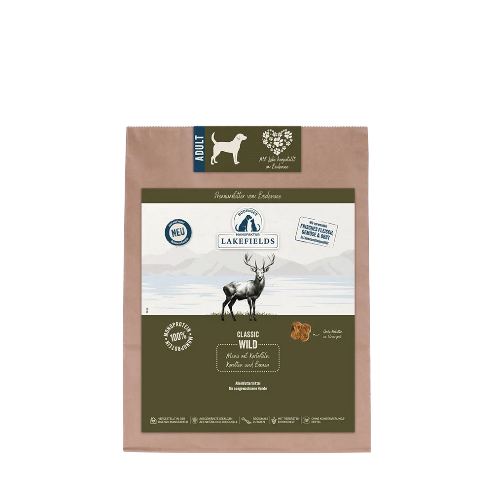 Braune Verpackung von Lakefields Hundefutter "Trockenfutter-Menü Wild" für adulte Hunde mit Rentier und Berglandschaft.